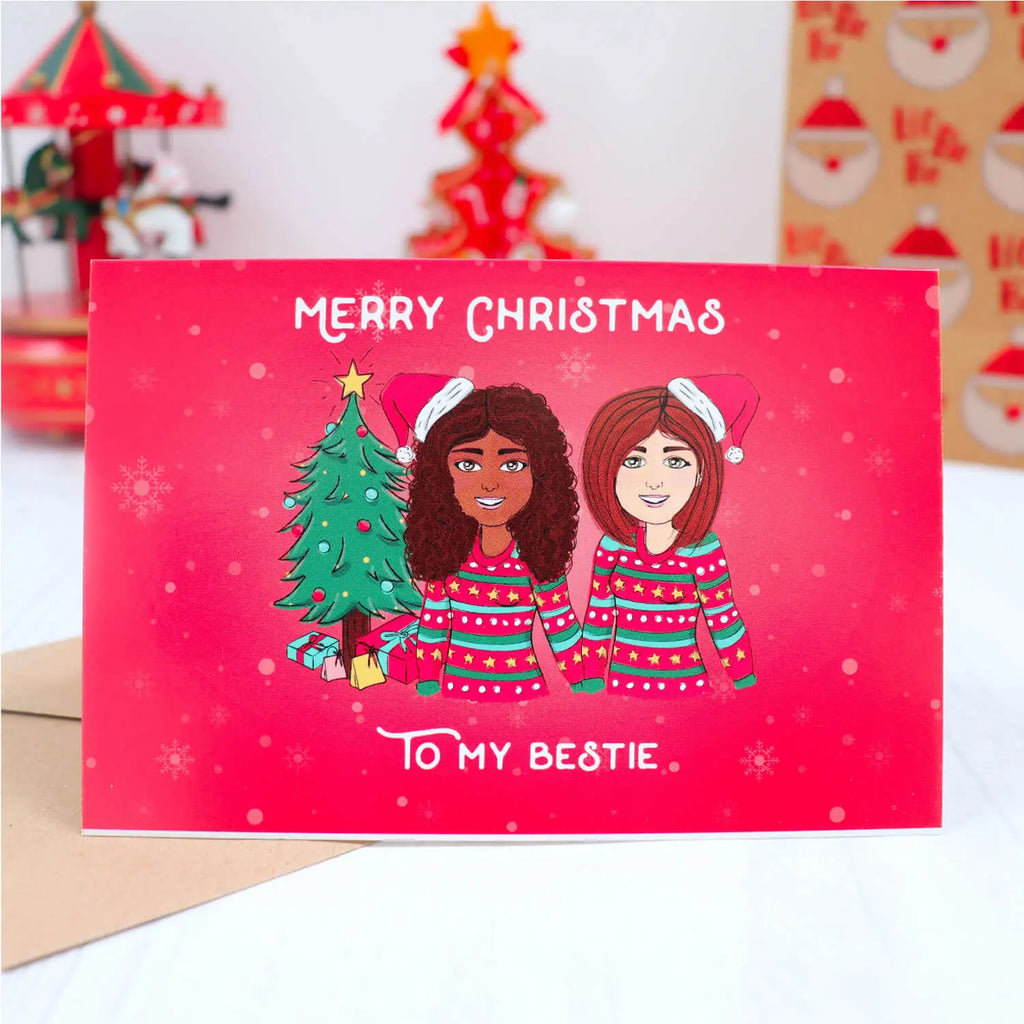 Personalised best friend Christmas card with customised girls cartoons wearing Xmas jumpers and Santa's hat on a red snow flakes background