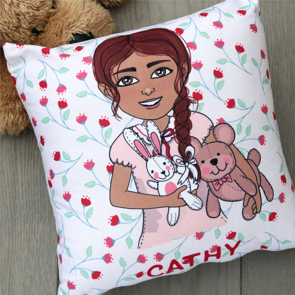 Personalised small square cushion with red floral pattern and a customised cartoon holding teddies